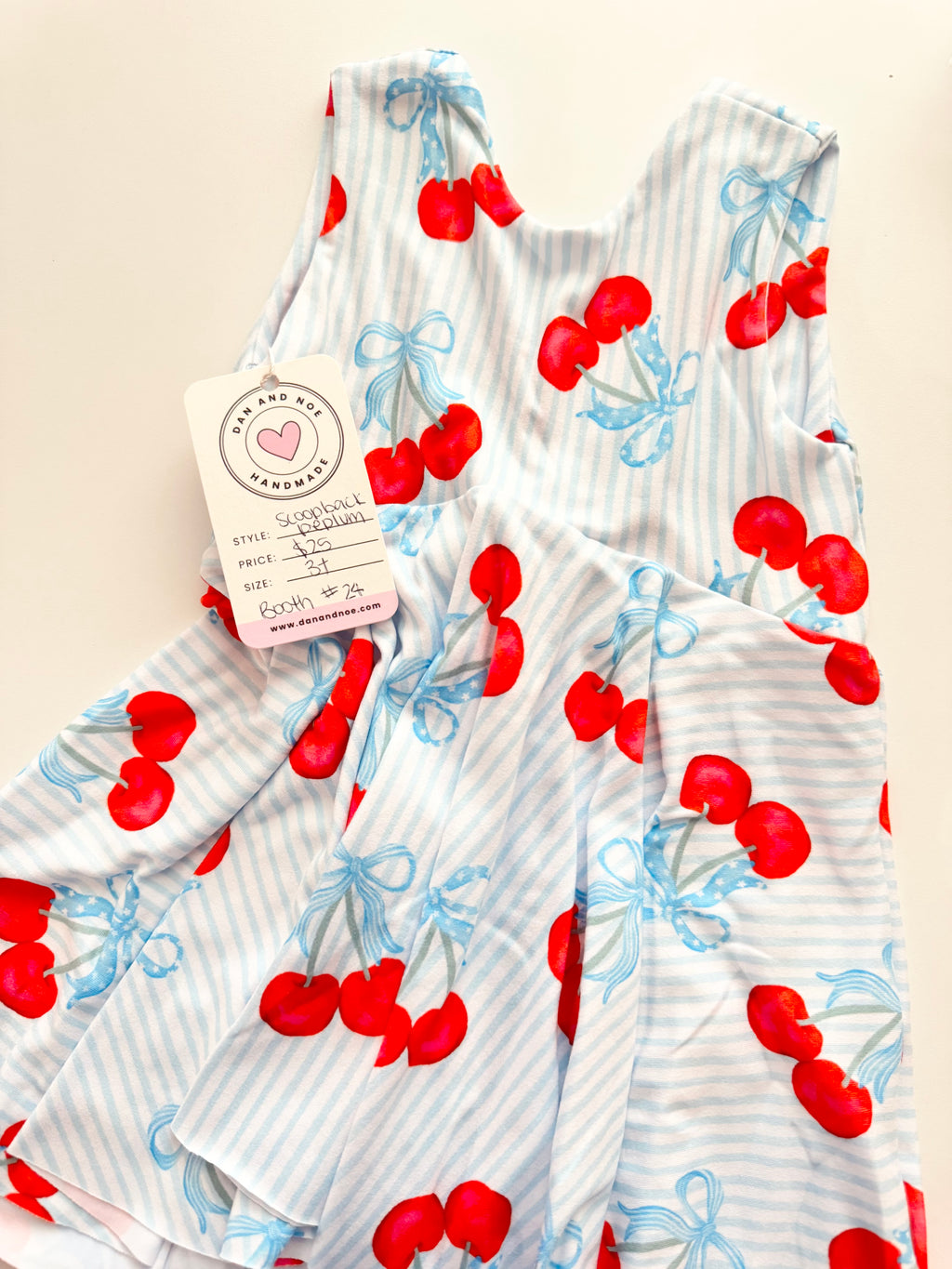 3T • SCOOP BACK PEPLUM